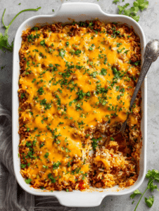 Taco rice casserole with ground beef and melted cheese
